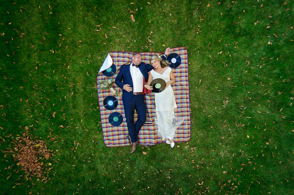 Married couple lying on the carpet or the earth.