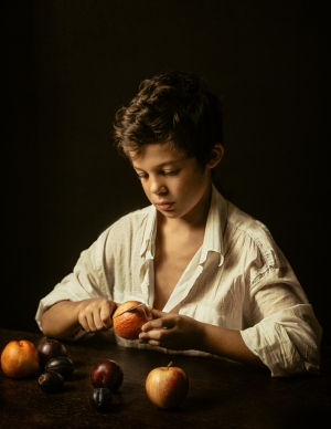 Boy peeling fruits