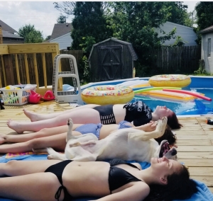 Just girls catching some rays by the pool. 