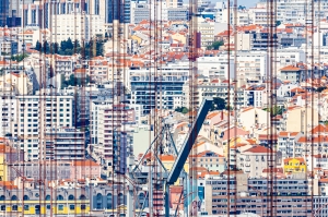 Lisbon through the cables of the 25th of April Bridge
