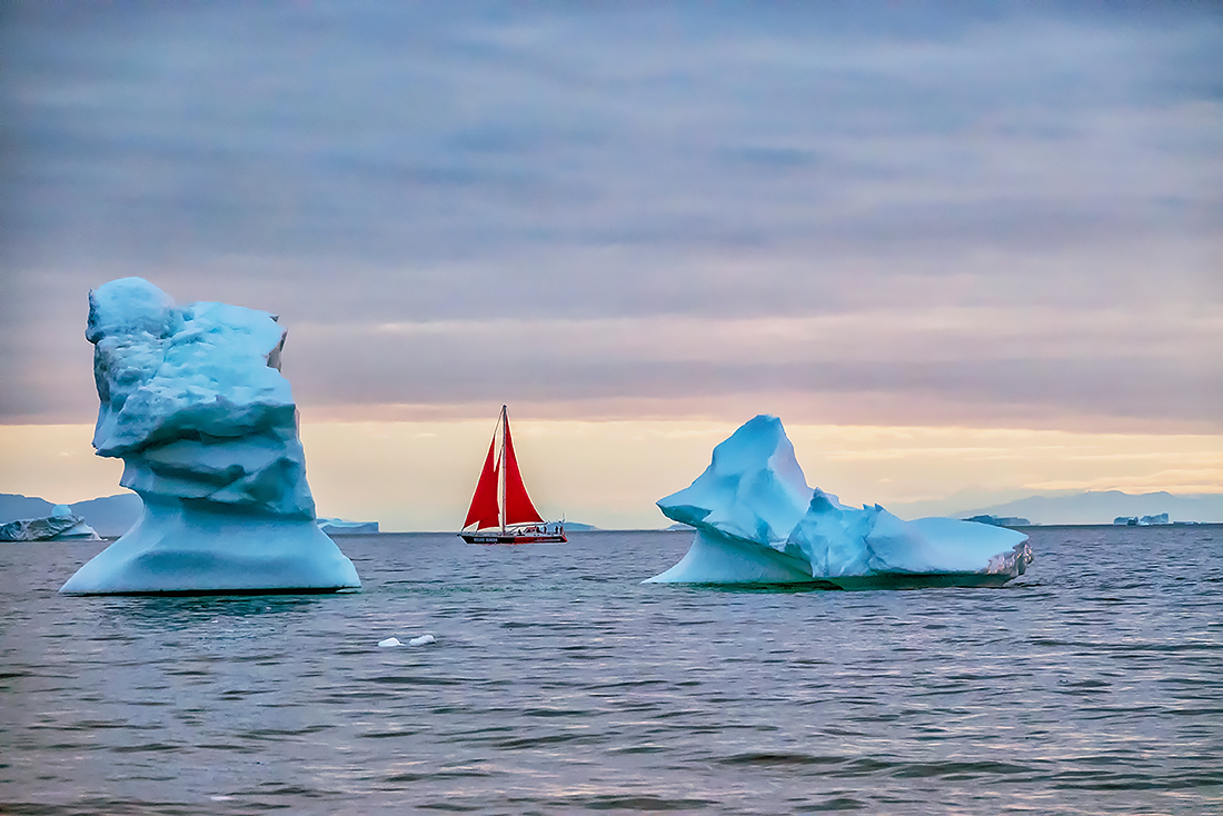 The midnight sun and iceberg in Greenland