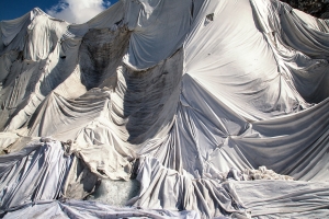 Incredible pictures show how one of The Swiss Alps oldest glaciers is being protected from melting - by covering it in BLANKETS