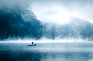 the catch of a fisherman in the mist