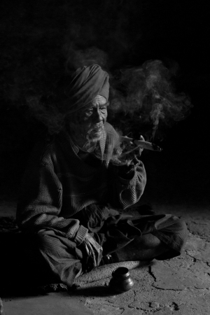 Burmese Old Man Smoking
