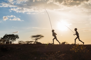 Boys running and playing at sunset, Southern Nations, Ethiopia