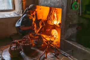 Preparing hot coals for sale, Jammu and Kashmir, India